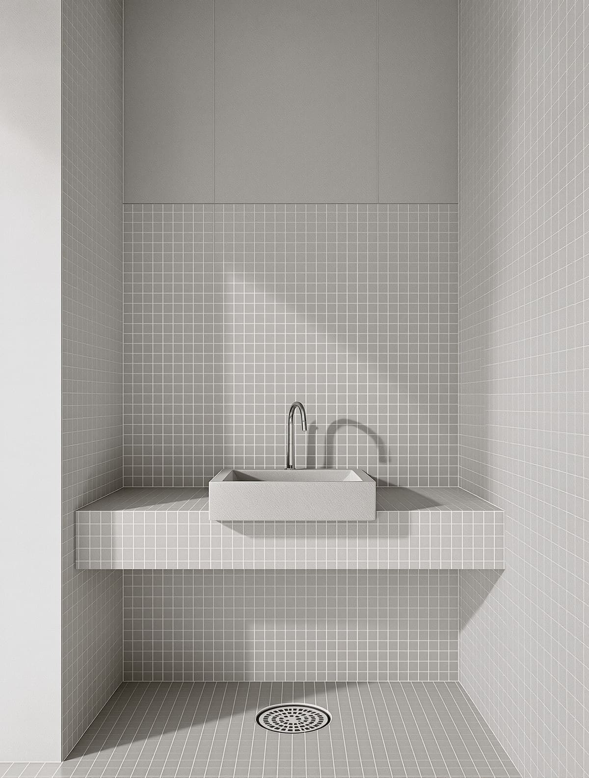 Öffentlicher Sanitärraum mit dunkler großformatiger Wandverkleidung, Mosaik an der Waschzeile und Glaswaschbecken